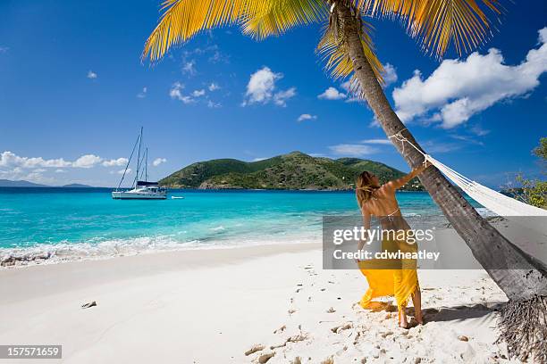 woman having fun on the tropical caribbean beach - yellow bikini stock pictures, royalty-free photos & images