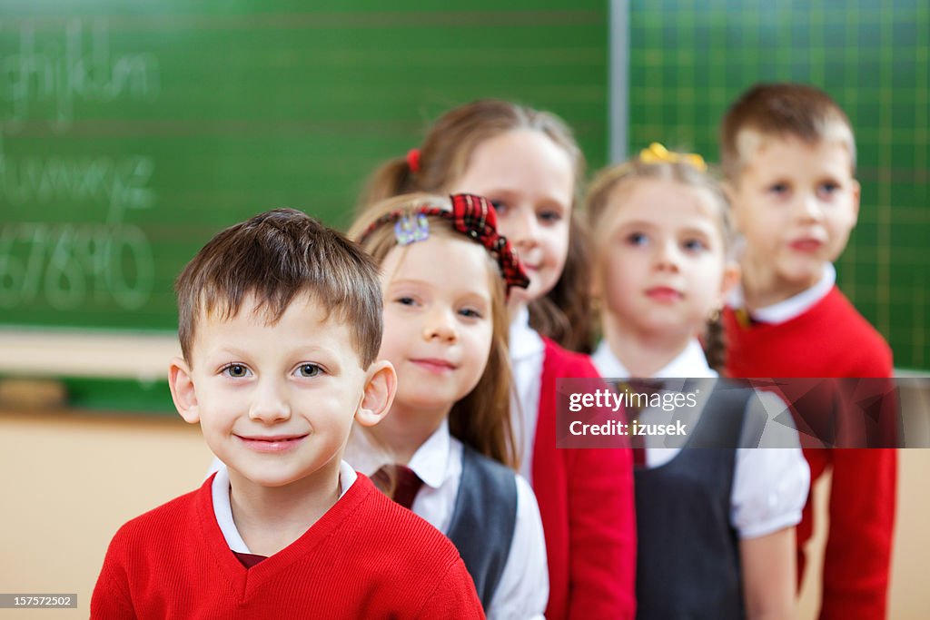 School Kids Standing In A Row, Classroom