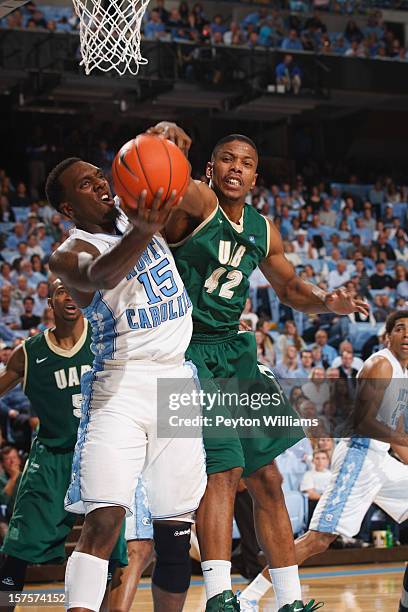 Hairston of the North Carolina Tar Heels struggles for possession while while defended by Rod Rucker of the Alabama Birmingham Blazers on December...