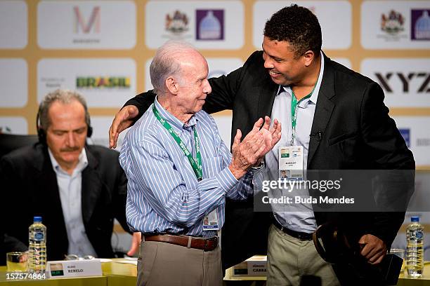 Ronaldo, former football star, greets Mario Jorge Lobo Zagallo, former football player and coach, after receiving a trophy for his career during the...