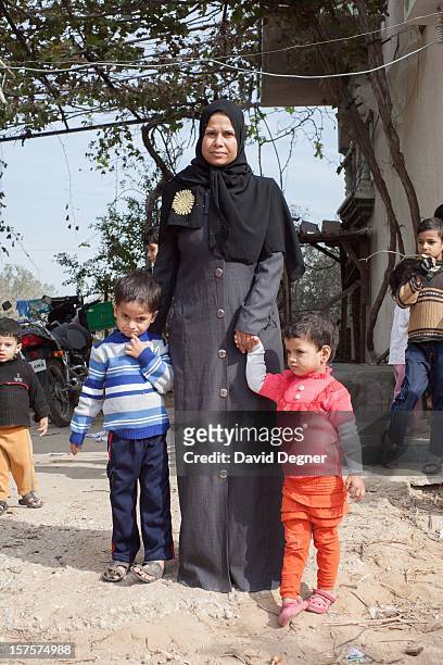 Mohammed Abu Mustafa, with his mother and sister, outside their home in southern Gaza on November 21, 2012. Mohammed Abu Mustafa was the subject of a...