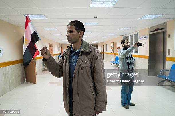 Ahmed Hassan, from Egypt, who says he is a representative from the Muslim brotherhood, stands in the hall of the Shifa Hospital Gaza City, Gaza on...