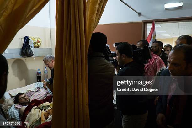 Delegation from Egyptian political parties, called the "House of Families," comes to take their picture with the wounded in the Shifa Hospital in...