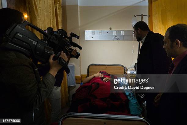 Delegation from Egyptian political parties, called the "House of Families" comes to take their picture with the wounded in the Shifa Hospital in Gaza...