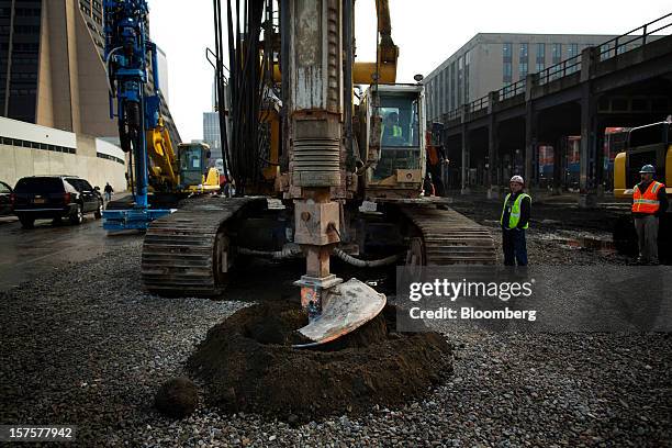 Construction crew makes a hole during the groundbreaking ceremony for the Hudson Yards development in New York, U.S., on Tuesday, Dec. 4, 2012....