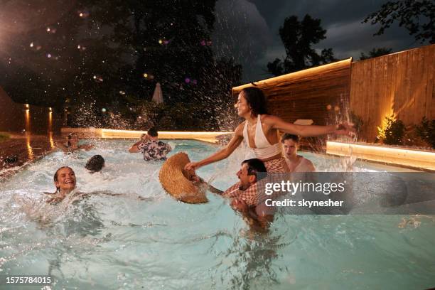 fun in the pool at night! - pool party night stock pictures, royalty-free photos & images