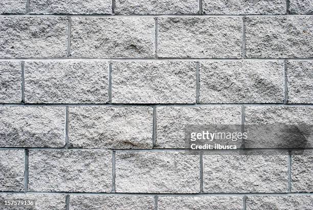 weiße ziegel wand textur aus granit - steinwand stock-fotos und bilder