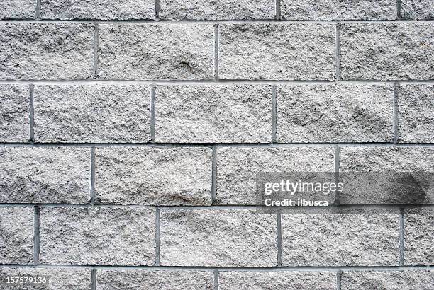 white granite brick wall texture - stenen muur stockfoto's en -beelden