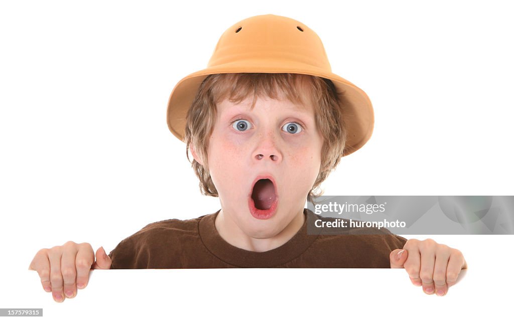 Surprised boy with pith helmet