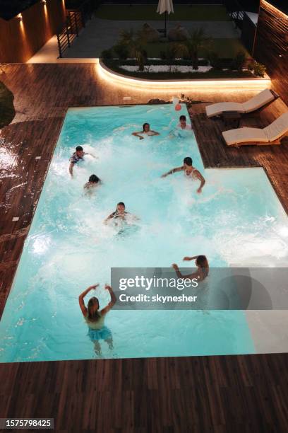 pool party at night! - pool party night stock pictures, royalty-free photos & images
