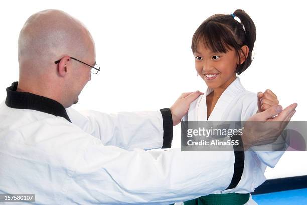 martial arts instructor is training a new student - karate girl isolated stock pictures, royalty-free photos & images