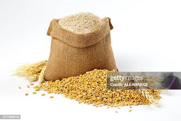 wheat grain and bran sack - flour bag stockfoto's en -beelden