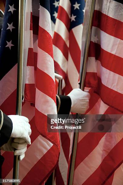 holding the united states of america flags - armed forces day stock pictures, royalty-free photos & images