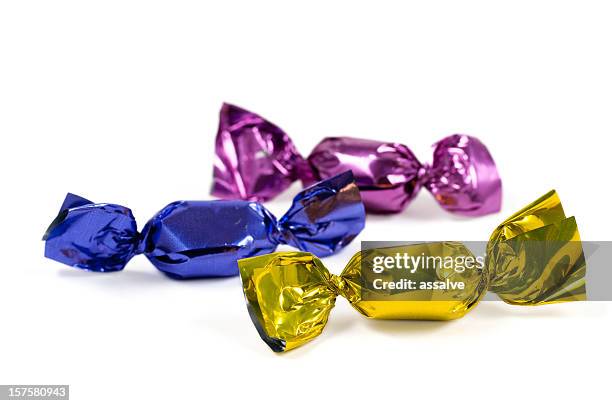 candy in colorful foil - bonbons stockfoto's en -beelden