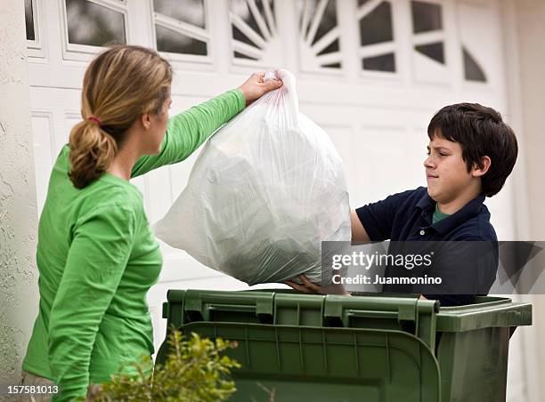 helping mom - holding garbage bag stock pictures, royalty-free photos & images