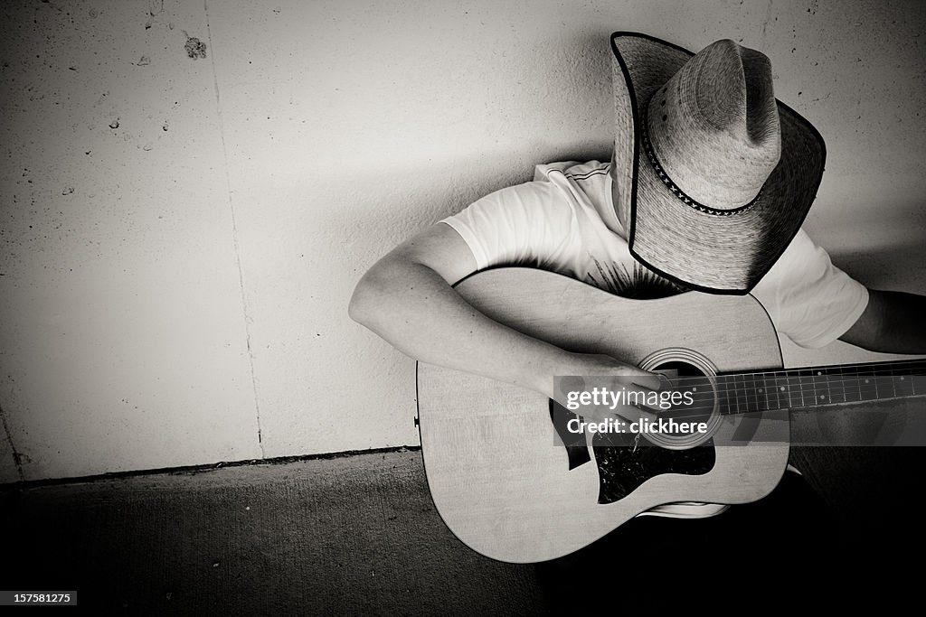 Cowboy spielt Gitarre