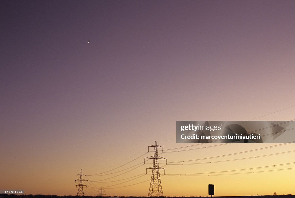 Electrical Moon - Electricity pylons in a sunset sky