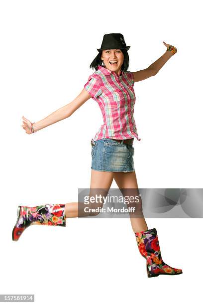 young happy woman in incredible boot jumping for fun - skirt isolated stock pictures, royalty-free photos & images