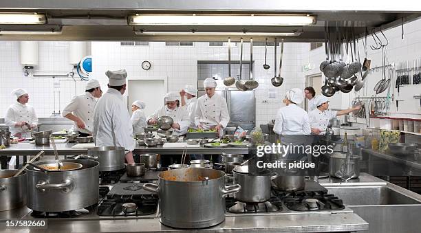 chef trainees preparing dinner - kockar bildbanksfoton och bilder