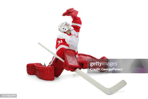 hockey goalie making save - hockey player on ice stock pictures, royalty-free photos & images