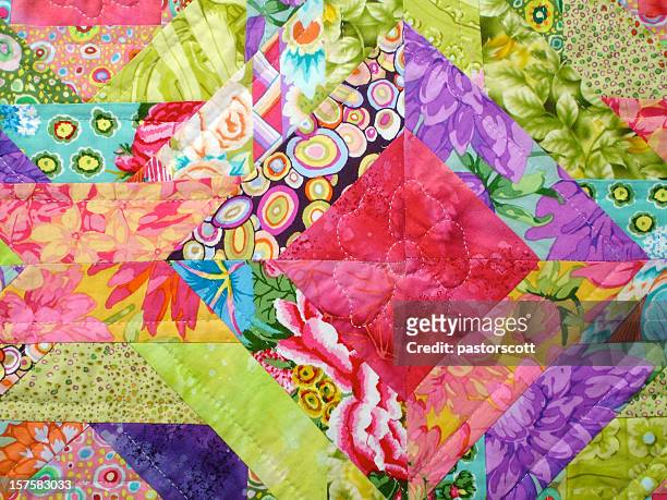 quilt made with colorful squares - duvet stock pictures, royalty-free photos & images