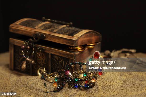 buried pirates treasure chest - treasure chest stock pictures, royalty-free photos & images