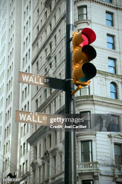 stop light on wall street in lower manhattan - red light stock pictures, royalty-free photos & images