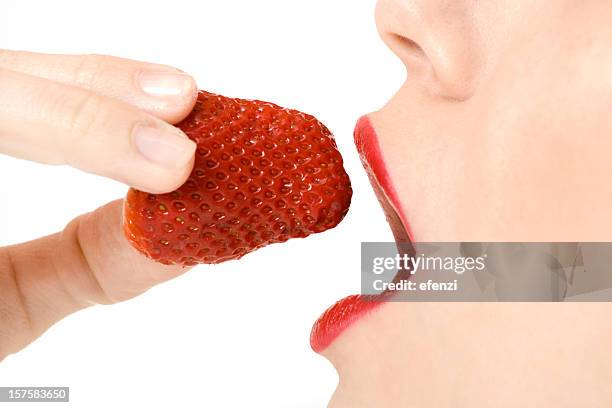 eating strawberry - mouth open profile stock pictures, royalty-free photos & images