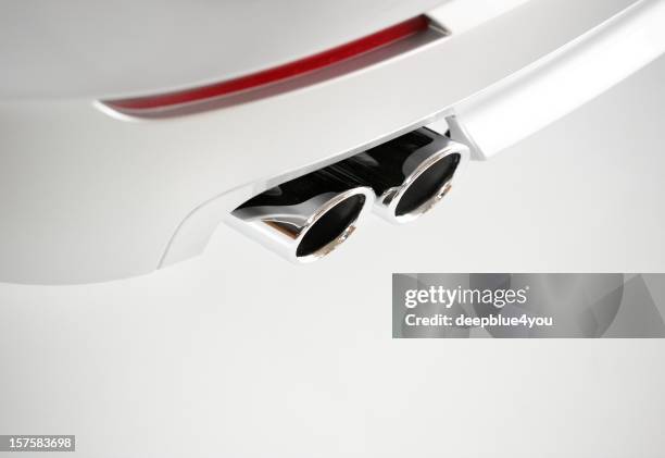 car with exhaust pipes in chrome - white car white rims stock pictures, royalty-free photos & images