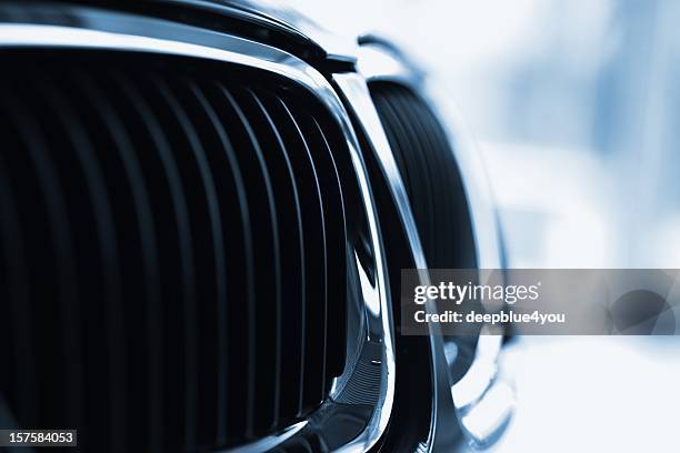 front grille of a modern sports car - grille stockfoto's en -beelden