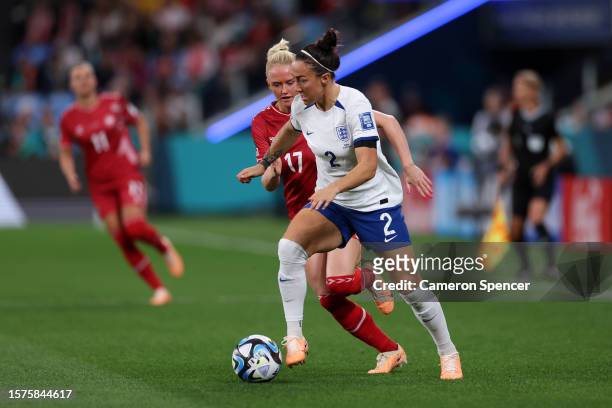 Lucy Bronze of England runs with the ball whilst under pressure from Rikke Marie Madsen of Denmark during the FIFA Women's World Cup Australia & New...