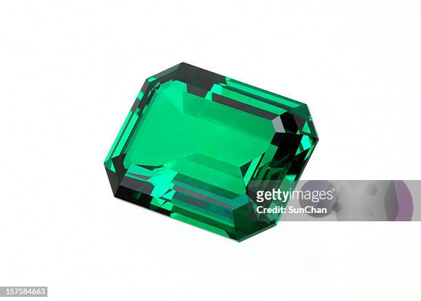 single green emerald stone on a white background - emerald gemstone stockfoto's en -beelden