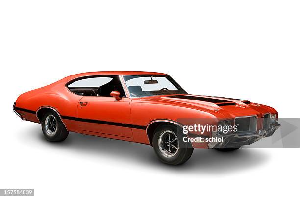orange oldsmobile 442 against a plain white backdrop - 1970s muscle cars stockfoto's en -beelden
