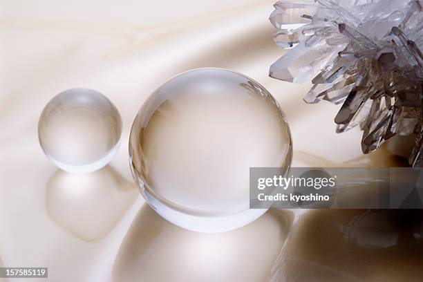 close-up of crystal ball with crystal - quartz stockfoto's en -beelden