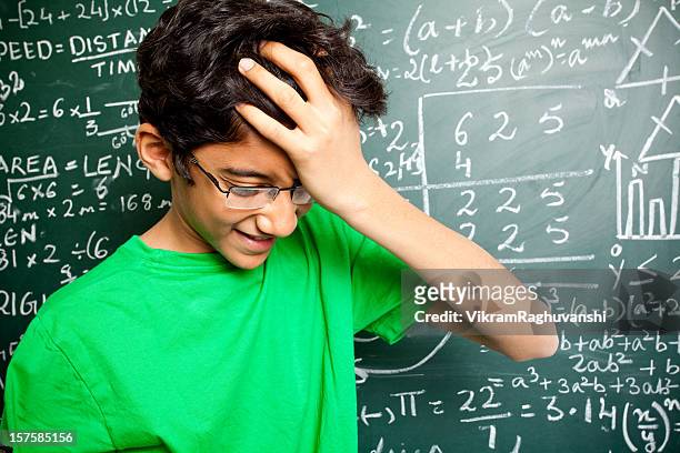 frustated confused indian teenager student with mathematics problems - number 14 stockfoto's en -beelden