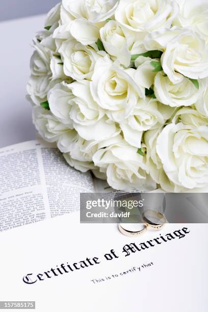 rings and marriage certificate - marriage certificate stock pictures, royalty-free photos & images