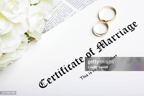 rings and marriage certificate - marriage certificate stock pictures, royalty-free photos & images