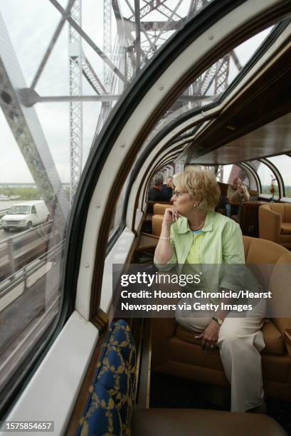 Lady Jane Percival, of Sugar Land, views the Mississippi River from a bridge as they depart New Orleans aboard the private rail cars of Patrick Henry...