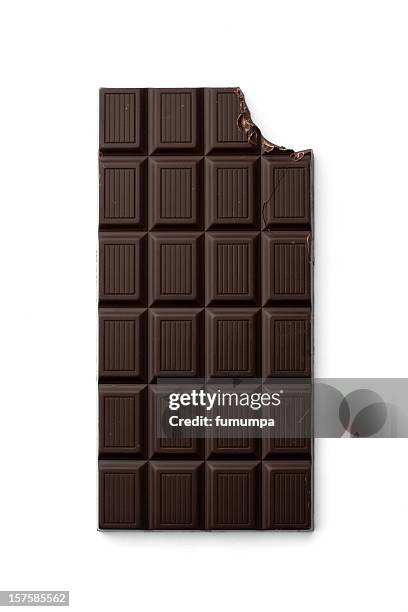 chocolate bar with bite taken from top right corner - dark chocolate stock pictures, royalty-free photos & images