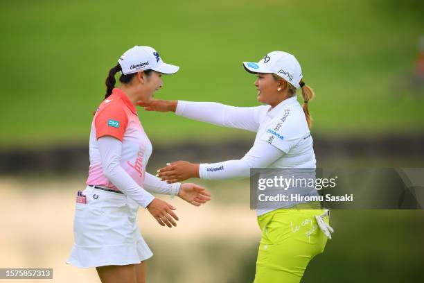 Sakura Koiwai of Japan hugs with Ai Suzuki of Japan after holding out on the 18th green during the second round of Rakuten Super Ladies at Tokyu...