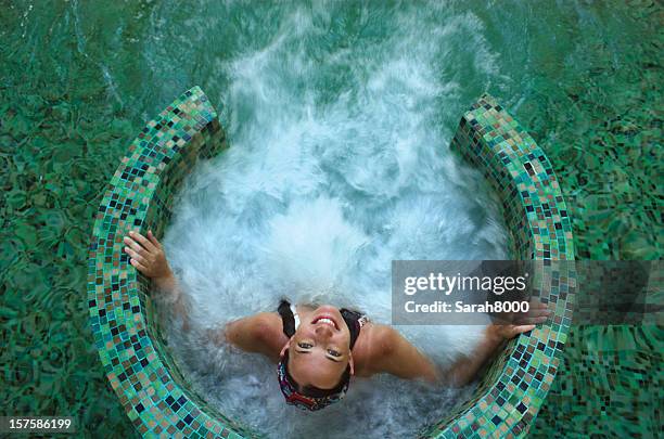 spa pool - girls in hot tub stockfoto's en -beelden