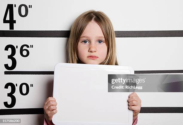 mugshot of a little girl - girl mugshots stock pictures, royalty-free photos & images