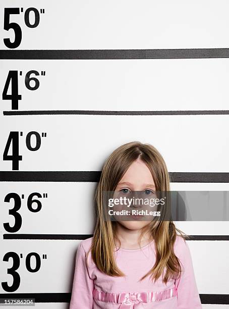 mugshot of a little girl - girl mugshots stock pictures, royalty-free photos & images