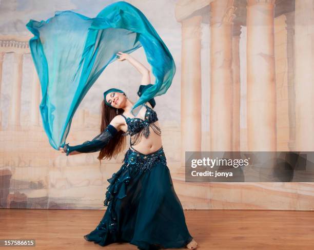 belly dancer throwing veil in the air - belly dancing stock pictures, royalty-free photos & images