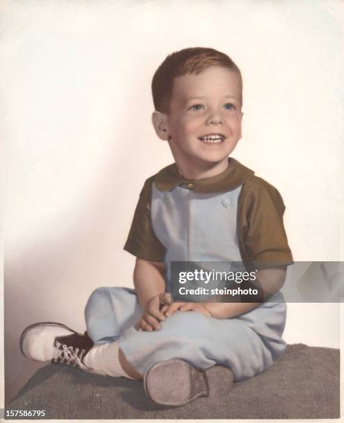 a vintage portrait of a young boy smiling - 1960 stock pictures, royalty-free photos & images