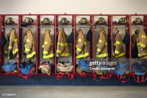 firehouse gear - coat hanging stock pictures, royalty-free photos & images