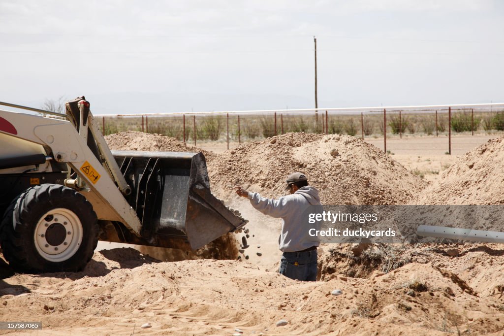 Dumping Rocks in New Drain Field for Septic System