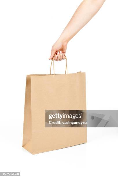shopping bag - hand holding shopping bag stock pictures, royalty-free photos & images