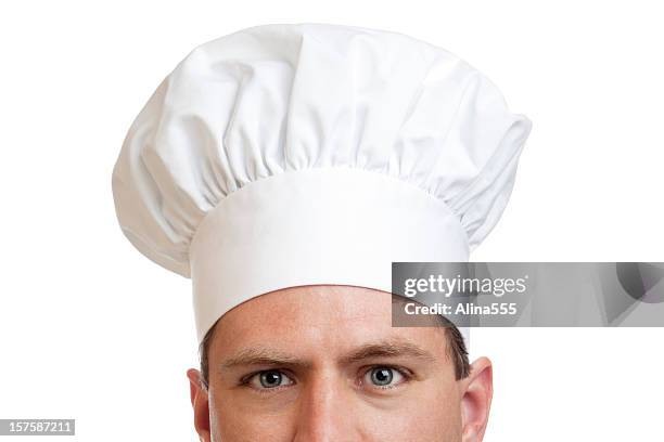 eyes of a cook with white chef hat - chef hat stock pictures, royalty-free photos & images