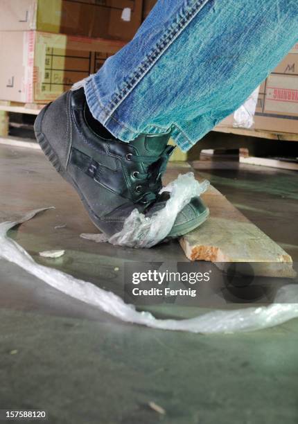 dangerous trip hazard in a warehouse - trip hazard sign stock pictures, royalty-free photos & images